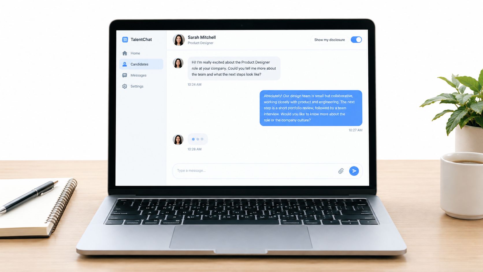 A laptop on a wooden desk displaying an AI interview assistant chat interface with a job candidate.